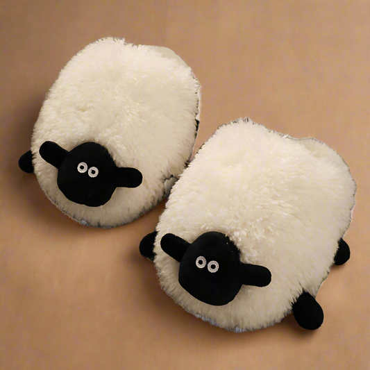 Comfy sheep-shaped slippers in soft white fleece with 3D ears and a gentle expression, perfect for cozy feet.